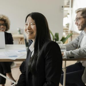 diverse group of business people in office focus on asian woman